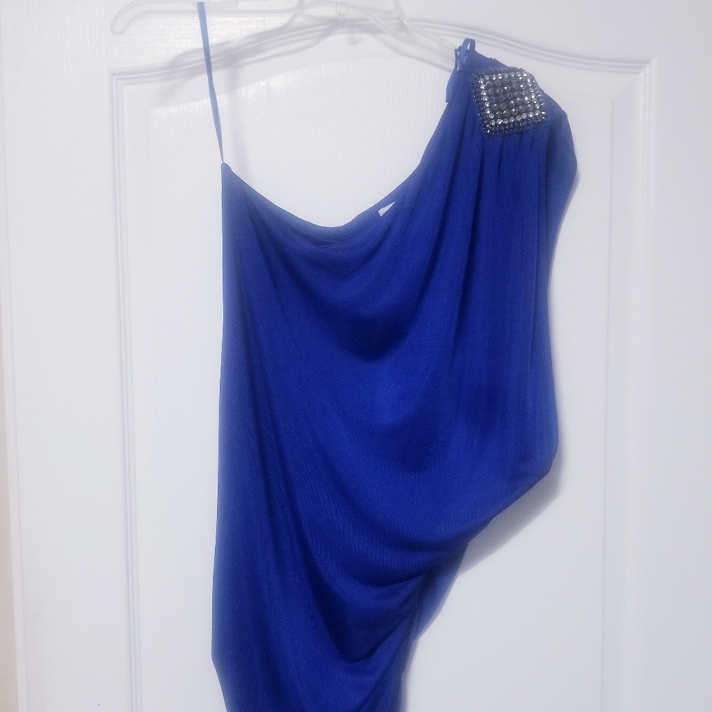 Blue one shoulder dress.